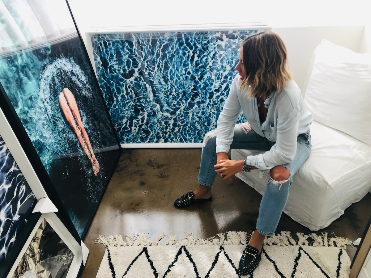In Too Deep by DANIELLEX, Danielle Cross seated beside the water print